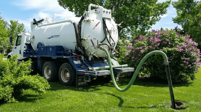 Professional vacuum truck performing residential drainage and septic maintenance in Akron, OH